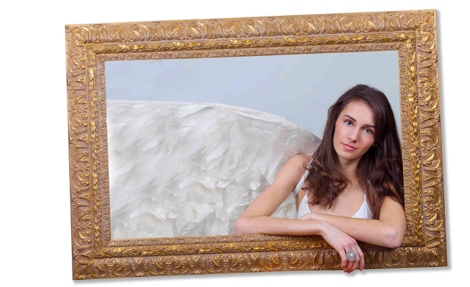 Ornate picture frame with girl with angle wings inside the frame