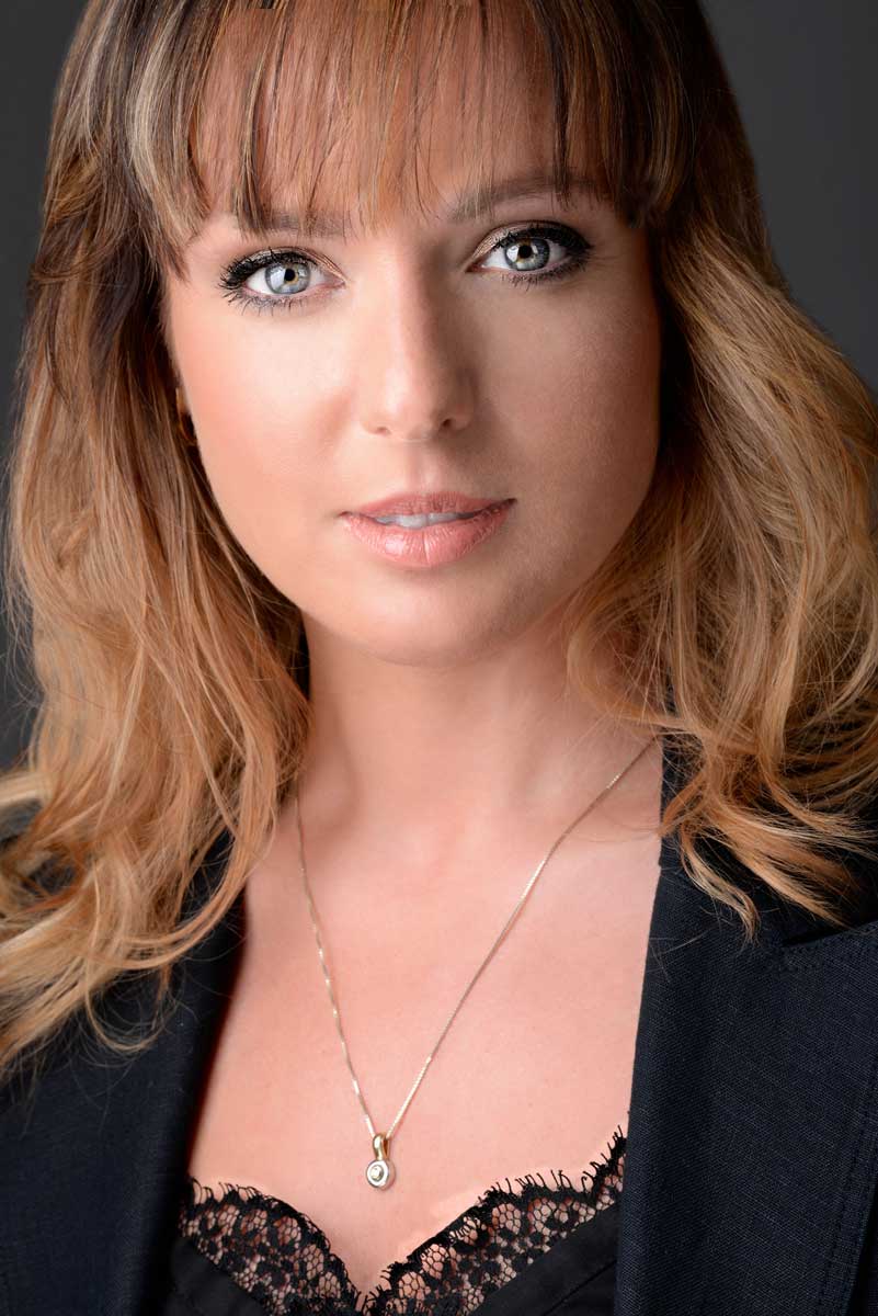 LinkedIn Headshot of women with blue eyes taken by Exposures Photography